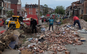Residents pick up the pieces after May 16, 2025 tornado hit north St. Louis.