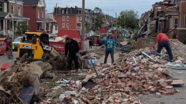 Residents pick up the pieces after May 16, 2025 tornado hit north St. Louis.